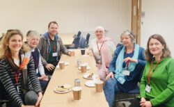 University of Leeds staff around coffee table